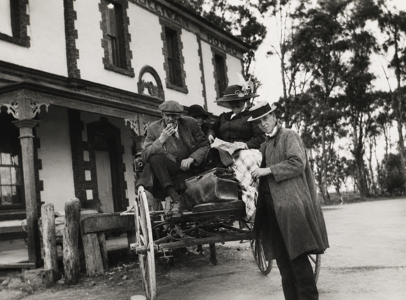 Black-and-white photograph of passengers in a horse-drawn buggy parked outside the Emu Hotel, Morphett Vale, 1910