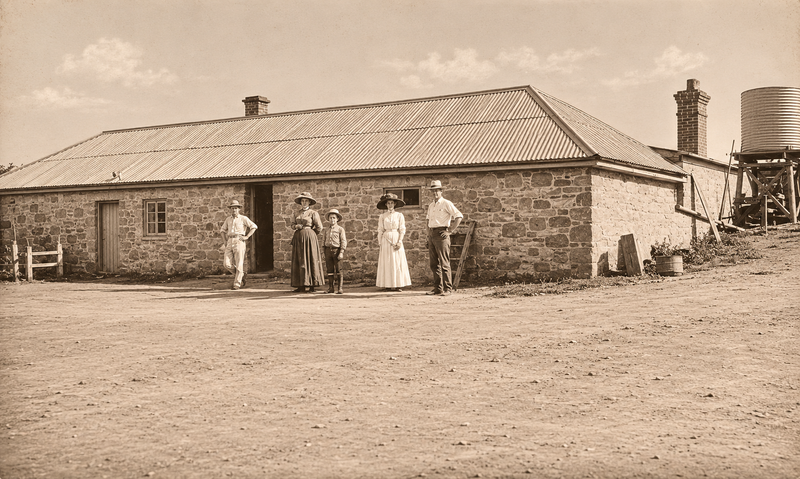 Mr. and Mrs. Kenny and family standing outside the Clarendon Bakery, early twentieth century